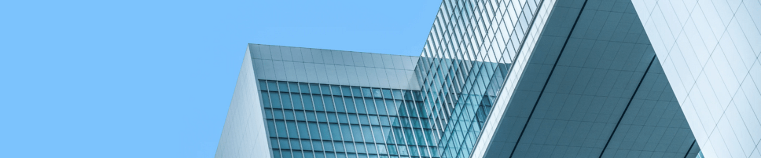 Large office building under a clear blue sky